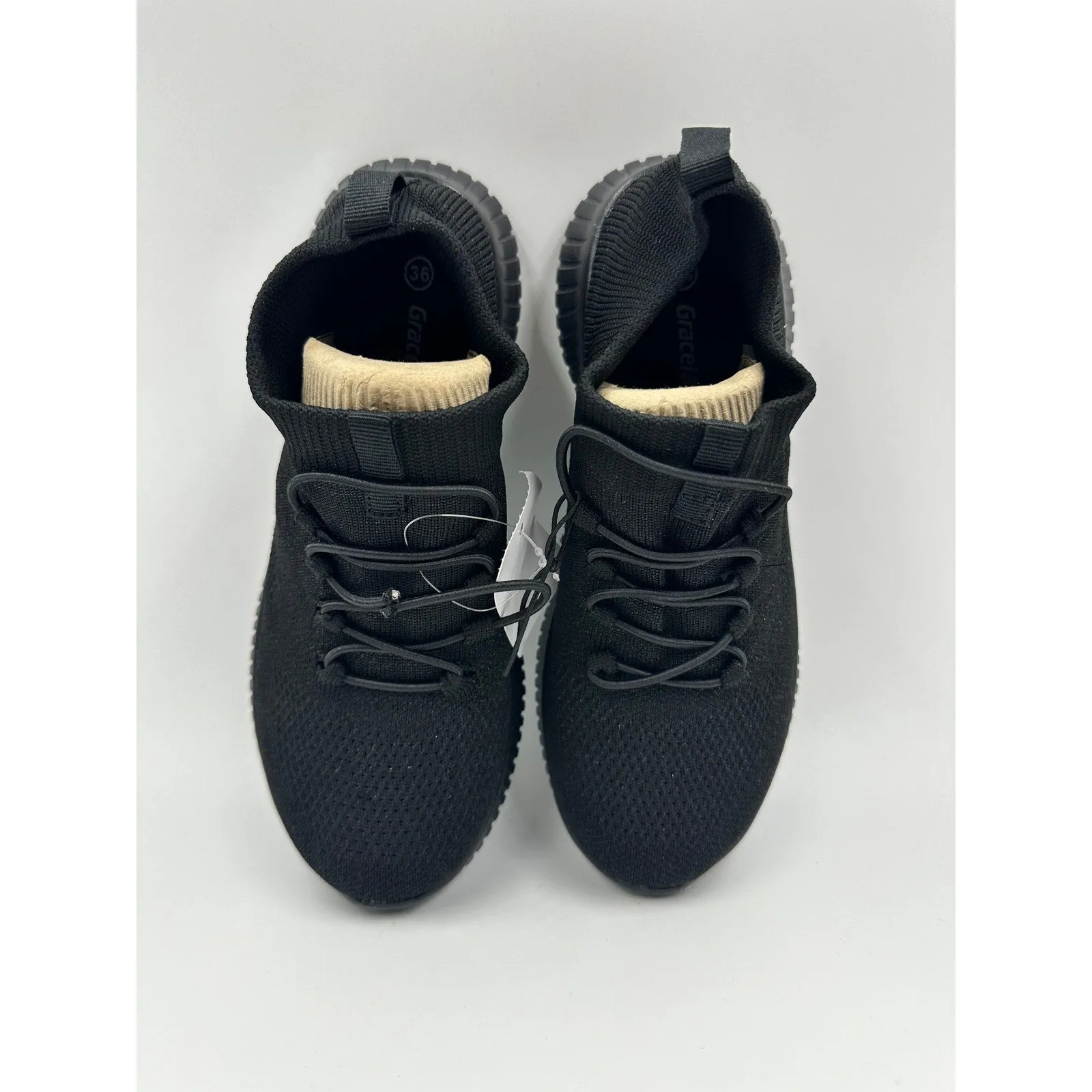 Women's size 5, Low Top All Black Sneaker with Elastic Laces and Glitter Accents